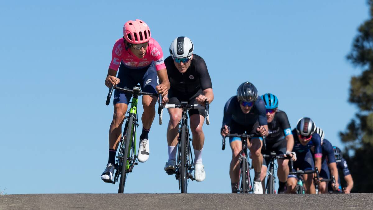 Top mark: Lachlan Morton (in the pink) achieved a new Everesting world record last week, achieving an elevation gain of more than 8848 metres in seven and a half hours. Photo: Ryan Miu/Cycling NSW.