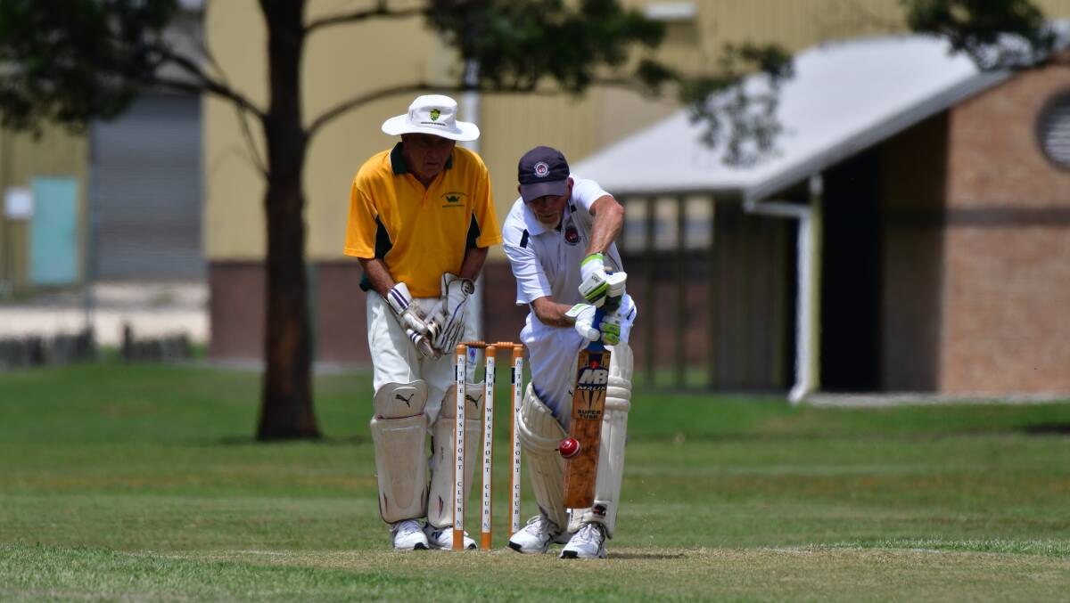 Head down: Warren McWilliams plays a forward defence for Mid North Coast at the over-70 state cricket titles.