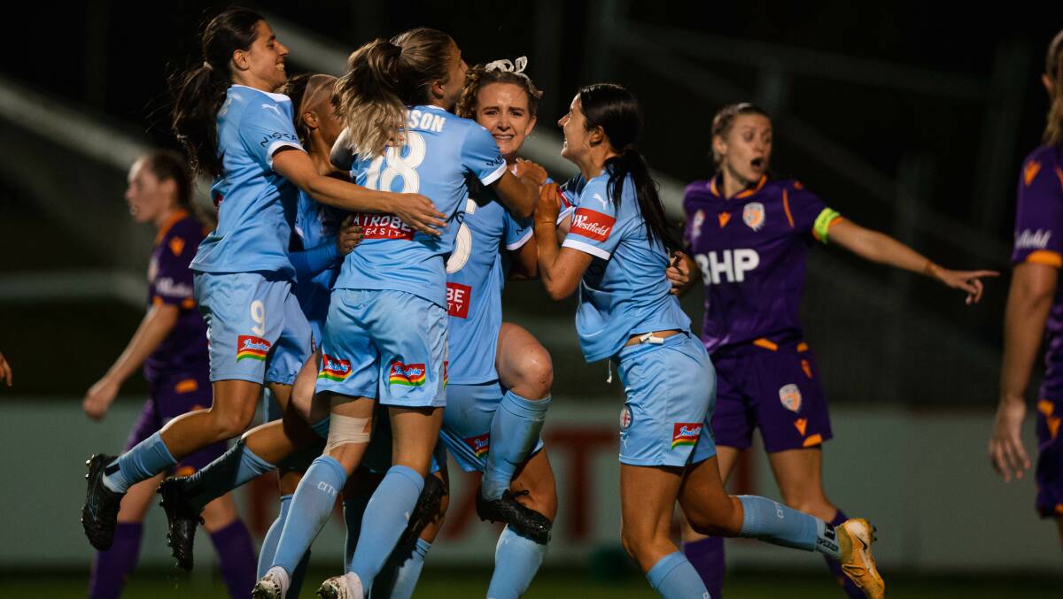 Fairytale: Rhali Dobson (centre) is mobbed by teammates after scoring in her farewell match. Photo: Melbourne City media