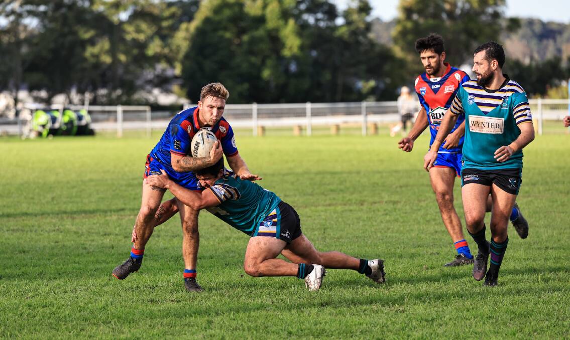 Jarren Lester attempts to break out of a Taree City tackle on Saturday. Photo: Lighthouse Sports Photography