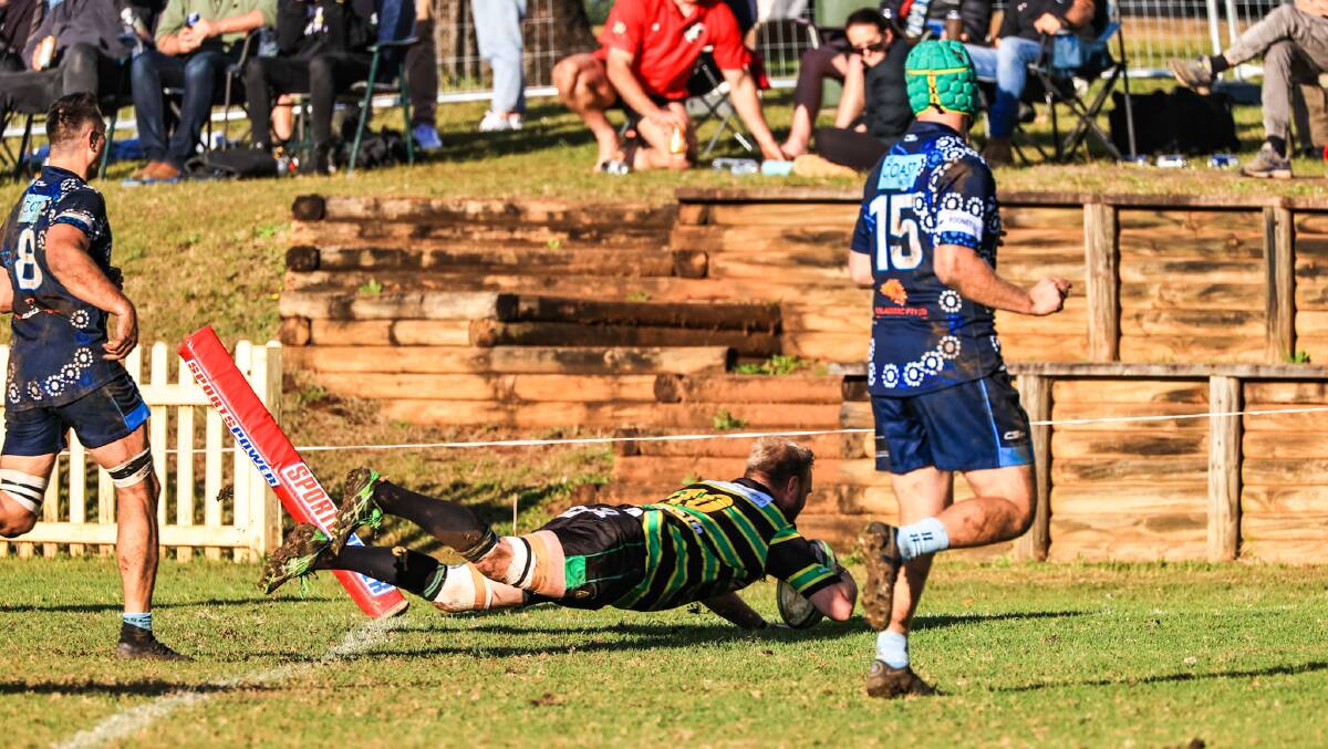 Dave Kennedy crosses for a second-half try. Photo: Lighthouse Sports Photography.