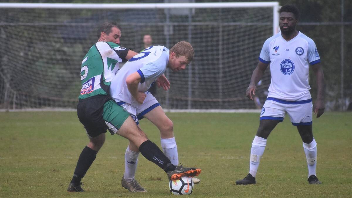 My ball: Simon Granfield battles for possession for Port United against Northern Storm. Photo: Facebook