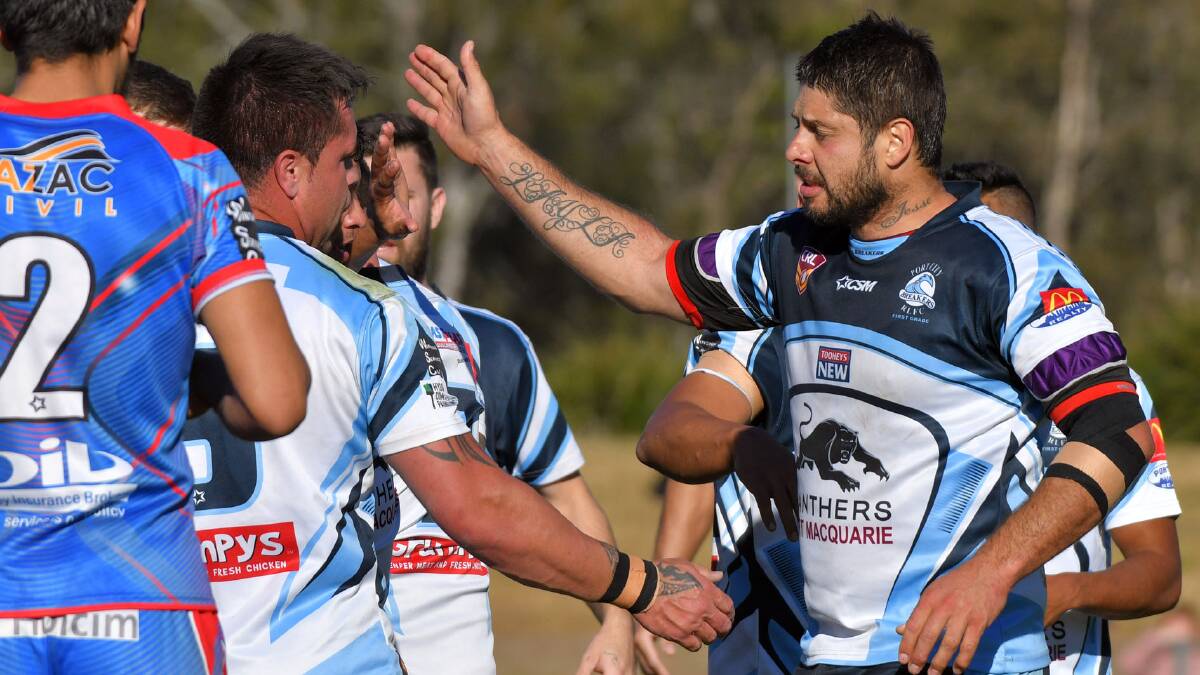 Job nearly done: Dan Dumas and Andrew Fox high-five during the Breakers 18-point win.