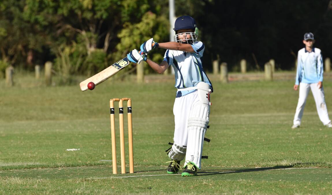Bat on ball: Port Macquarie junior cricketer Daniel Norris hits through the off side. Photo: Paul Jobber