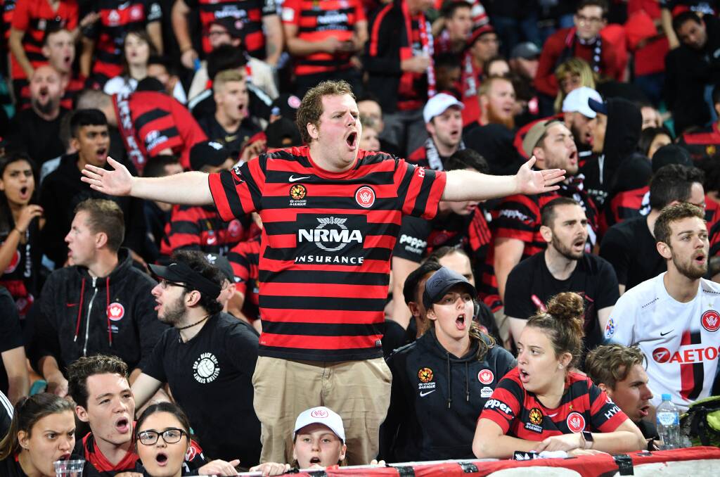 What: Wanderers fans are seen reacting to a VAR decision during the Round 2 A-League match between Sydney FC and Western Sydney Wanderers on Saturday. Photo: AAP/Brendan Esposito.