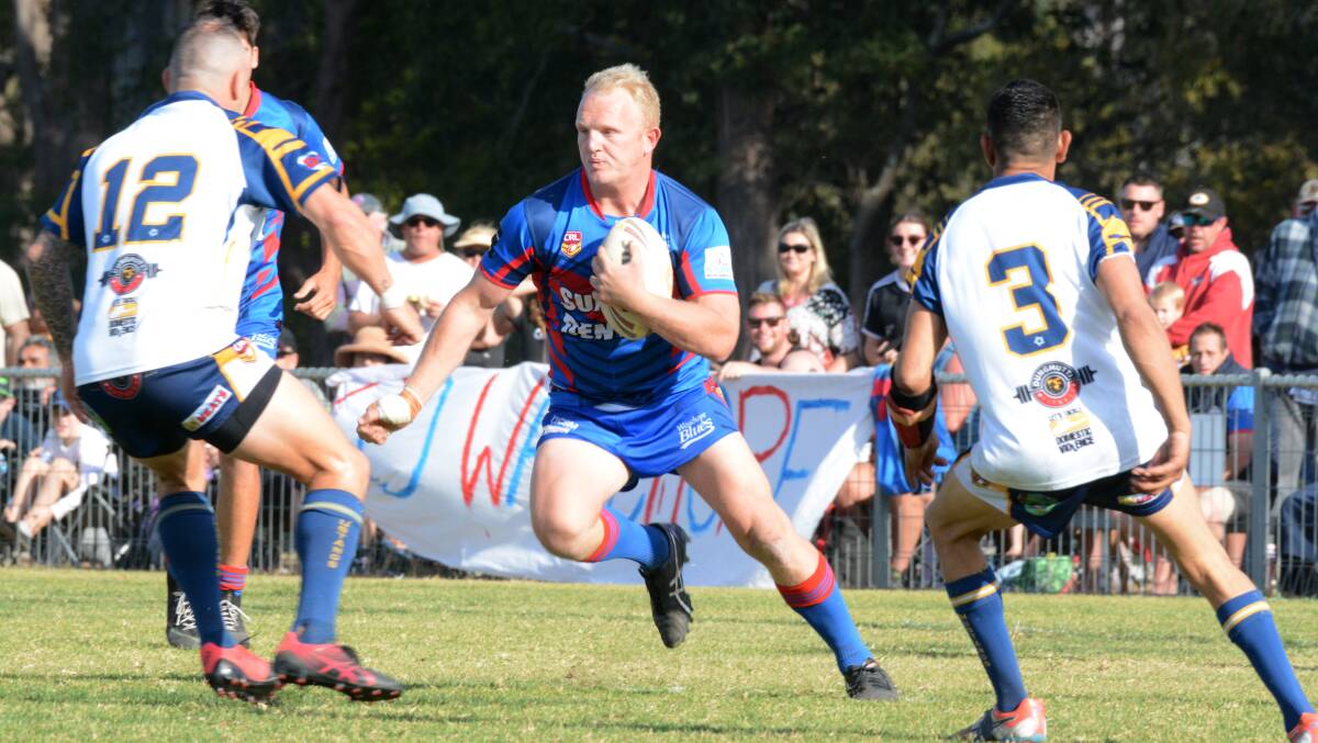 Motivated: Mat Bird charges into the Macleay Valley defence during last season's Group 3 grand final.