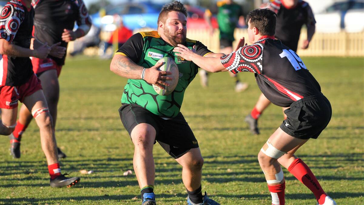 Hard to stop: Jeremy Segol pushes away from the Pirates defence during Saturday's 46-28 victory. Photo: Paul Jobber