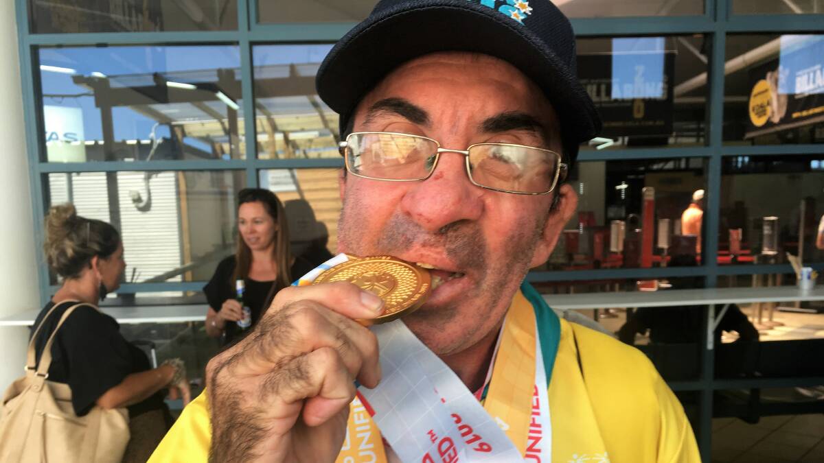 Taste of success: Darren Wallis with his gold medal. Photo: supplied