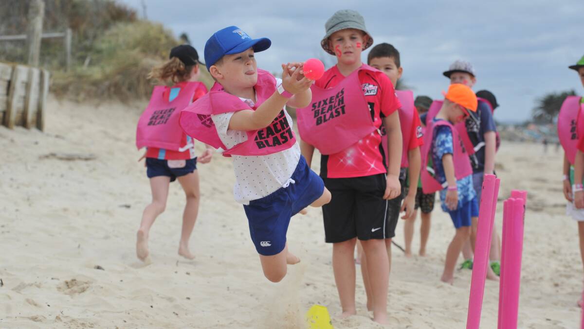 Got him: Sterling Wicklam attempts to take a catch at last year's Beach Blast in Port Macquarie.