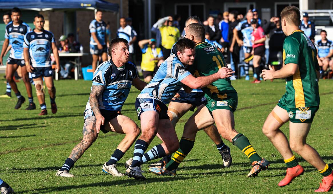 Port City's Luke Sinclair and Jake Kelly take on Forster-Tuncurry captain-coach Nathan Campbell. Photo: Lighthouse Sports Photography