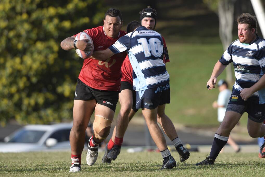 On the charge: Matt Farrance takes a hit-up against Southern Cross University on Saturday. Photo: supplied