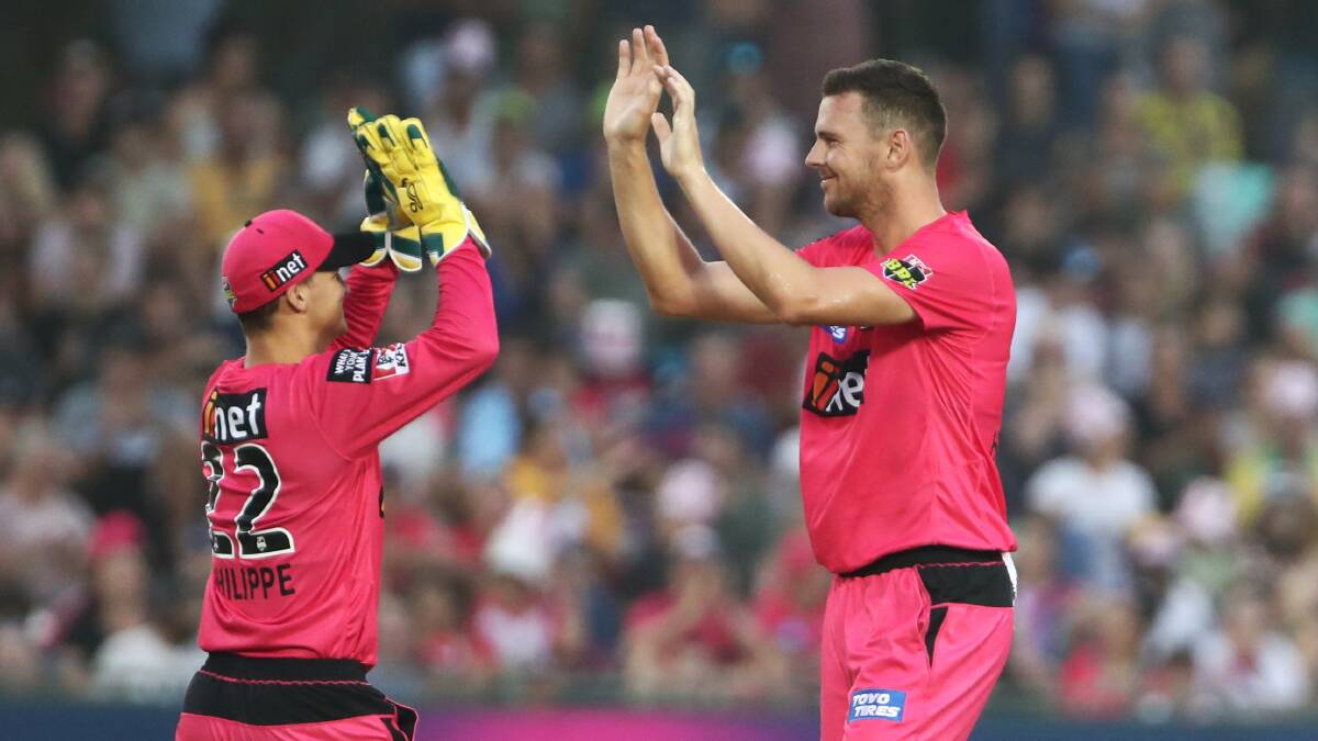 Key men: Sixers stars Josh Philippe and Josh Hazlewood celebrate a wicket in their win over Adelaide in Coffs Harbour on Sunday night. Photo: AAP/Cricket Australia
