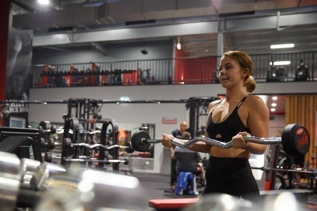 Tightening up: From Saturday, members such as World Gym Port Macquarie's Jessica Hoskin will no longer have 24-hour access. Photo: supplied