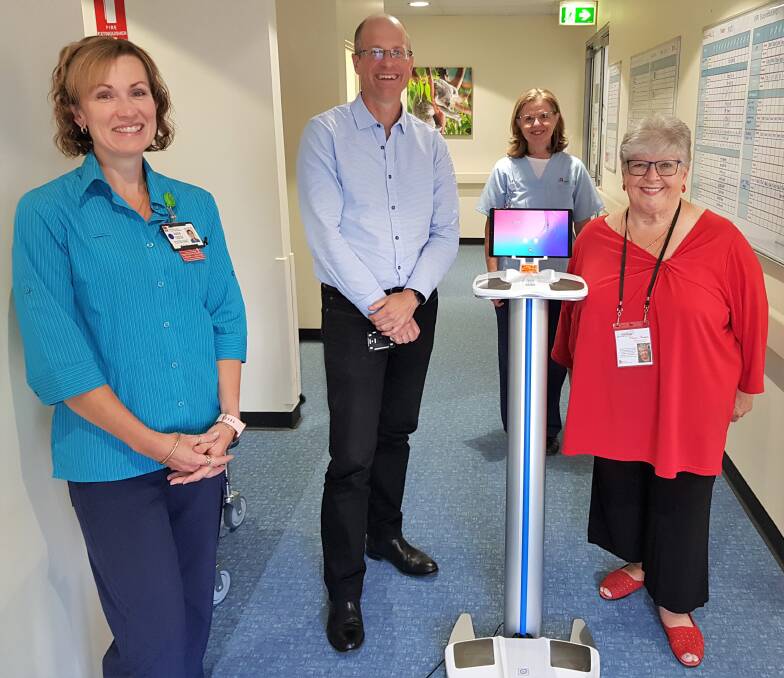Team effort: MNCCI occupational therapist Jodie Rossiter and breast cancer nurse consultant Joanne Woodlands were on hand to thank Hastings Cancer Trust chairman Dr Stephen Begbie and No One Fights Cancer Alones Patricia Knudsen for working together to donate the SOZO unit. Photo: supplied