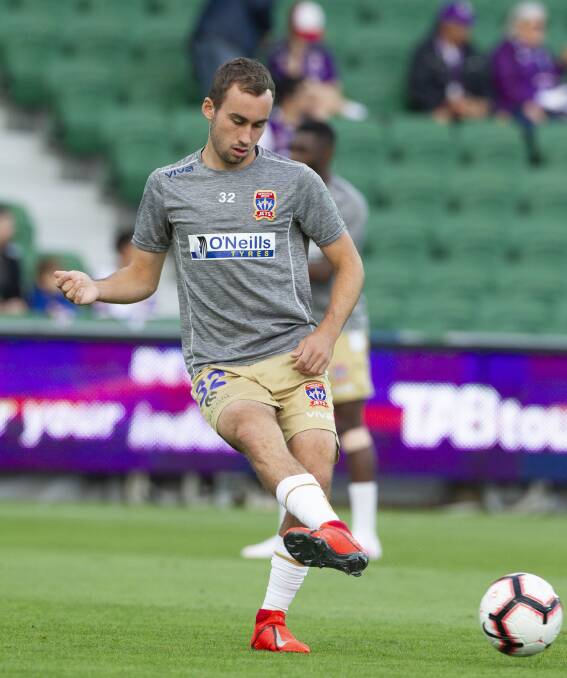 Making a claim: Angus Thurgate (pictured warming up in Perth last week) played a starring role as the Newcastle Jets trounced Brisbane Roar 6-1 on Saturday. Photo: AAP/Tony McDonough