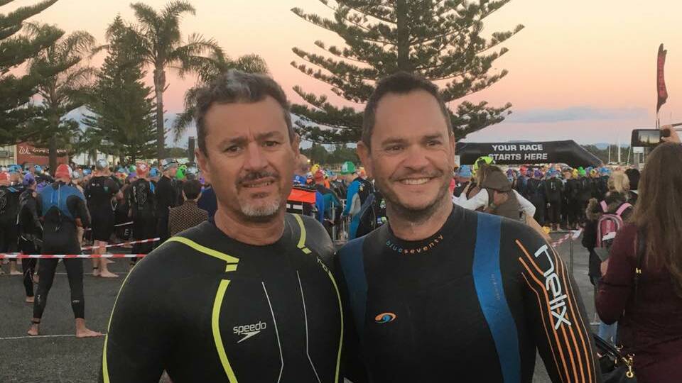 For you, mate: Wayne Jackson and Brendan Helsham at Ironman Australia Port Macquarie. Photo: supplied