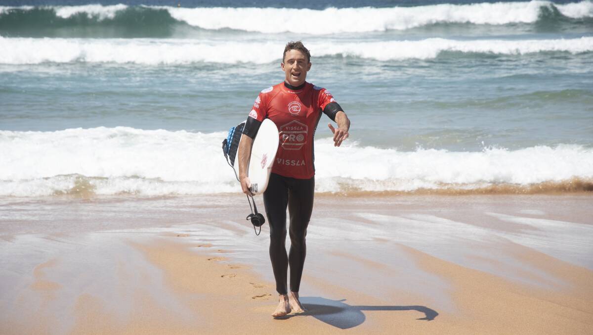 All smiles: Matt Banting returns to the beach during his Central Coast Pro win at Avoca Beach. Photo: Ethan Smith