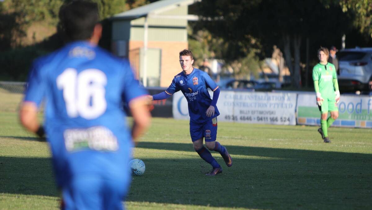Adam Sherratt playing for the Newcastle Jets in the National Youth League. Photo: supplied