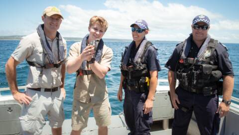 GO LUCKY: The crew on the water police boat off Stradbroke Island in Moreton Bay.