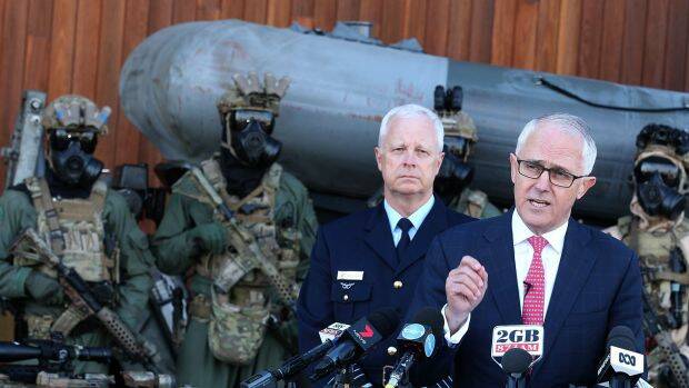 Prime Minister Malcolm Turnbull (with Chief of Defence Mark Binskin) announces proposed changes to terror response protocols at Holsworthy Barracks.  Photo: Ben Rushton
