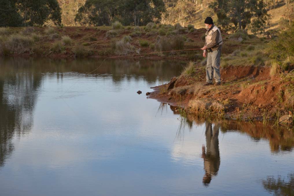 Barry Brown fly fishing at Stock Dam on Wondecla farm at Hunter Springs in Barrington Tops. Picture: Scott Bevan