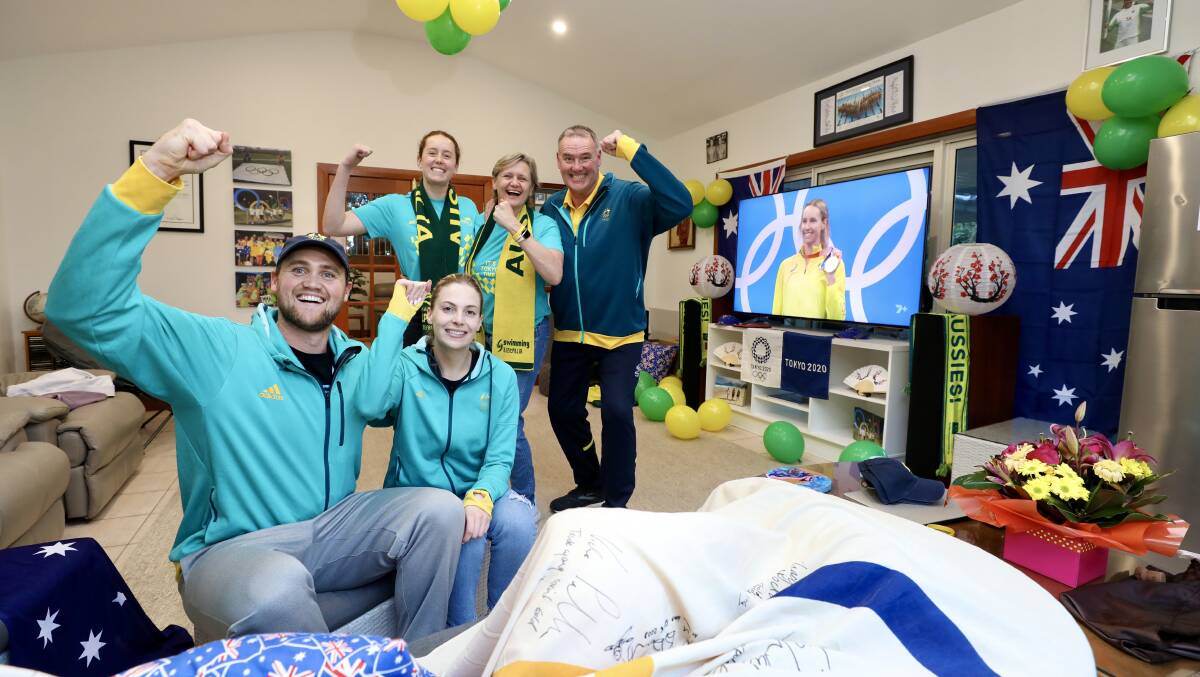 Let the celebrations begin: The McKeon family revel in Emma's gold medal at the Tokyo Olympics. Picture: Adam McLean
