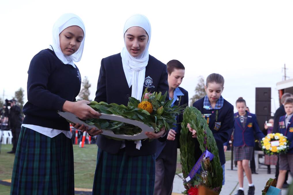 TRADITION: Laying a wreath entwined with rosemary, which symbolises remembrance, is popular on Anzac Day. Wreaths were first used by ancient Romans to crown victors.