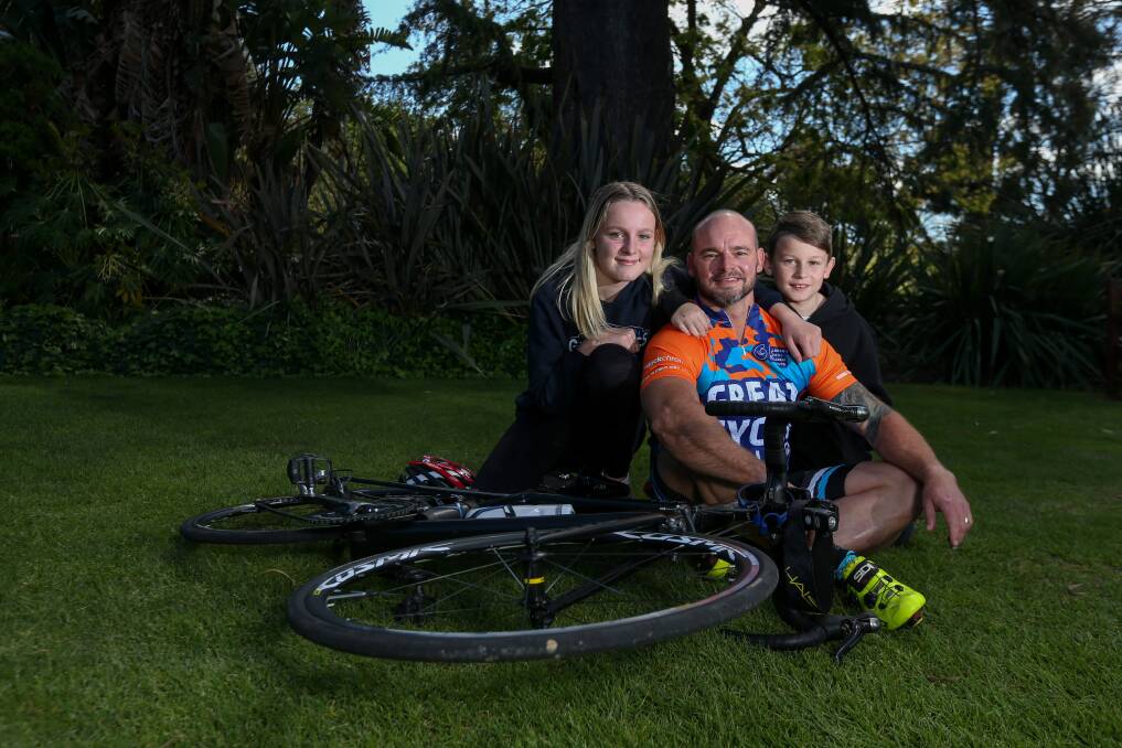 CHALLENGE ACCEPTED: Cancer survivor Justin Daly with his children Hunter, 12, and Edward, 10, ahead of the Great Cycle Challenge this month. Picture: TARA TREWHELLA