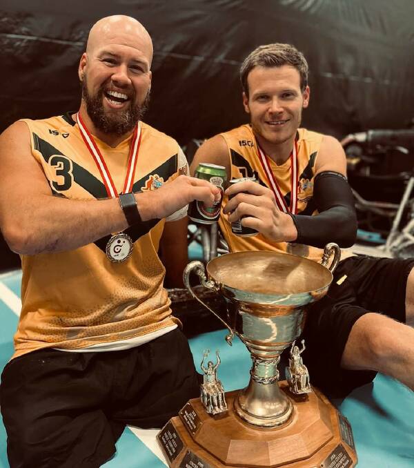 Ryley Batt and Andrew Edmondson with the world championship trophy. Picture: supplied/Facebook