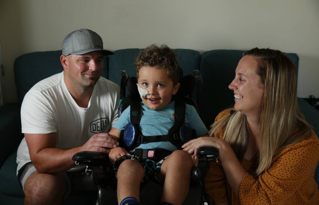 Life-changer: Cade, Vinnie and Nicole Fuller have spent most of the past three months at John Hunter Children's Hospital after Vinnie suffered a prolonged seizure and brain damage due to a condition so rare, he is the only known child in Australia to be diagnosed. Picture: Simone De Peak