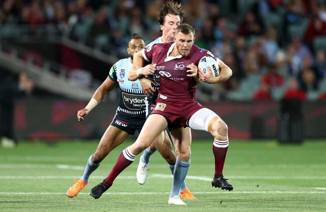 Queensland centre Kurt Capewell is manhandled by NSW opposite Clint Gutherson in State of Origin 1 of Wednesday night, but it was the former who was one of the game's best players. Picture: GETTY IMAGES