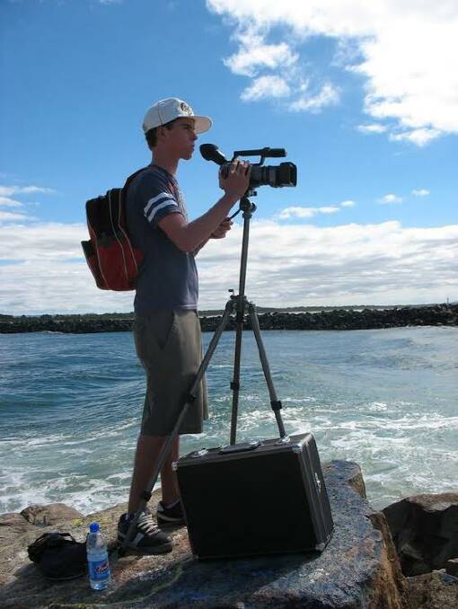 Andrew Turnham filming on the Port Macquarie breakwall. Photo: supplied