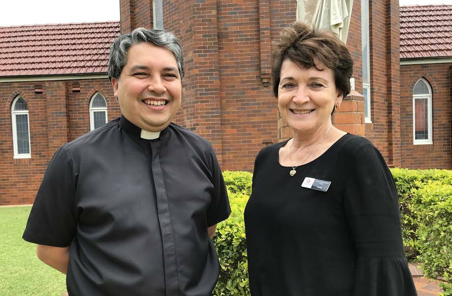 Fr Peter Wood and Anne O'Brien outside St Agnes' Parish in Port Macquarie.