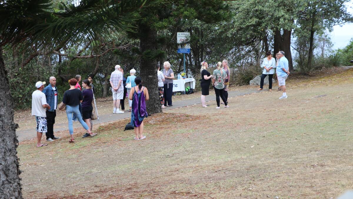 HEALING: Some of the people who attended the memorial service at Windmill Hill in Port Macquarie. Photo: Lisa Willows 
