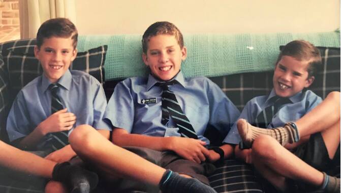 James Turnham (centre) with brothers Chris and Andrew. Photo: supplied