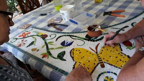 Artists working on the mosaic for 'The Lost Plot'. PHOTO: Krissa Wilkinson