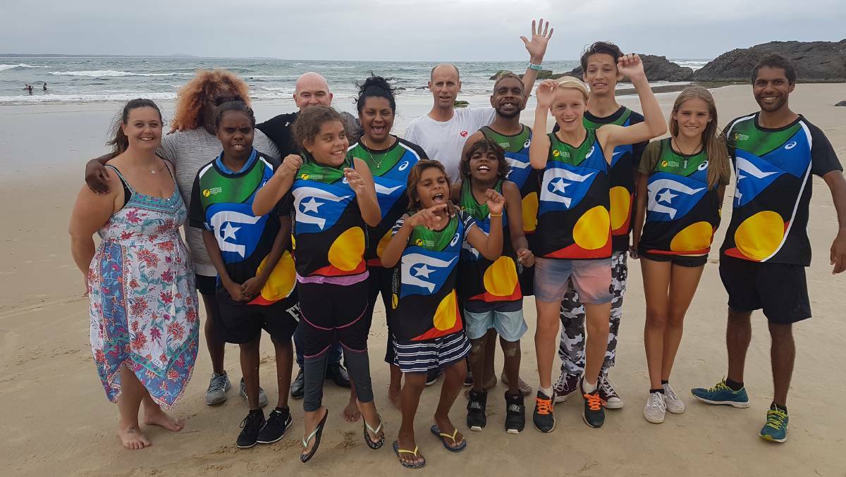 Town Beach: Former Australian Olympians Rob de Castella, Nova Peris and Steve Moneghetti (centre) with IMP participants in Port Macquarie.