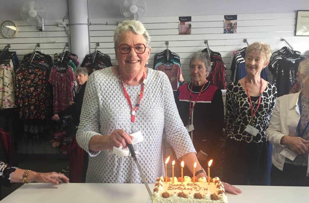 Years of service: President of the Royal Far West Port Macquarie branch Alice Miller cuts the cake.