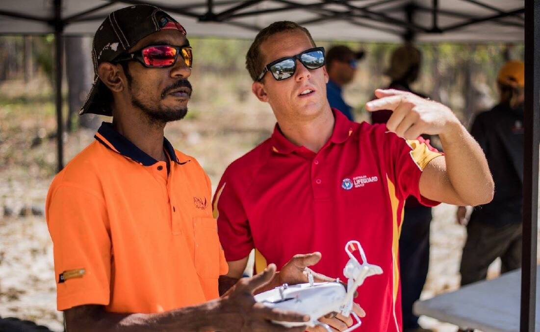 James Turnham in Cape York, Far North QLD teaching an Indigenous ranger about drones. Photo: supplied