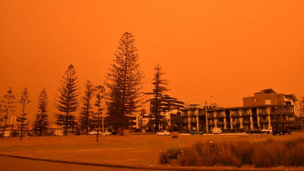 Eerie: The orange glow from bushfire smoke on November 8 last year. 