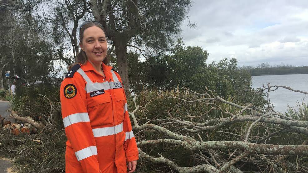 Port Macquarie SES unit deputy commander Katie Blake in front of storm damage on Settlement Point Road. 