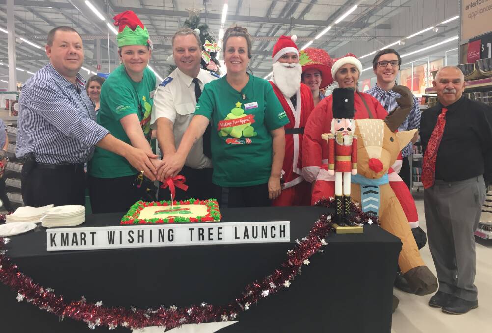 HELPING HANDS: The launch of the Christmas Wishing Tree Appeal in Kmart. Photo: Carla Mascarenhas