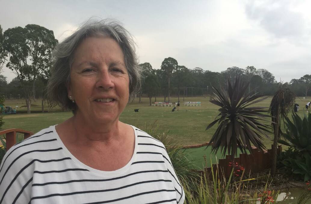 Struggling: Christine Smith at the Port Macquarie Golf Driving Range and Mini Golf. 