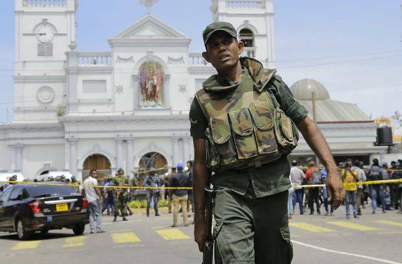 Sri Lankan Army soldiers secure the area around a church following deadly bomb blasts. PHOTO: Port News