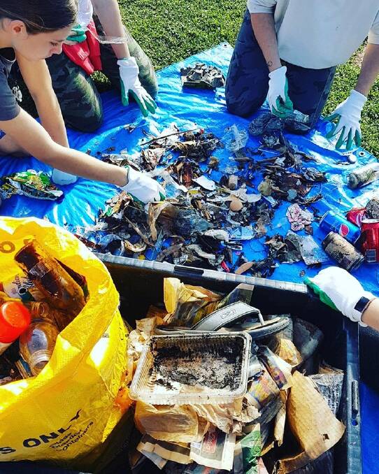 Litter: Volunteers go through litter found during a clean up a Shelly Beach. Photo: Coastal Warriors Mid North Coast. 