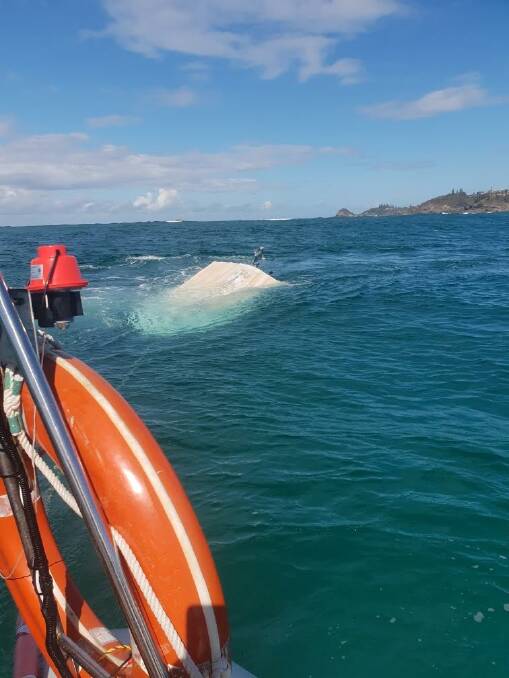 The rescue attempt of a rolled boat. PHOTO: Marine Rescue Port Macquarie