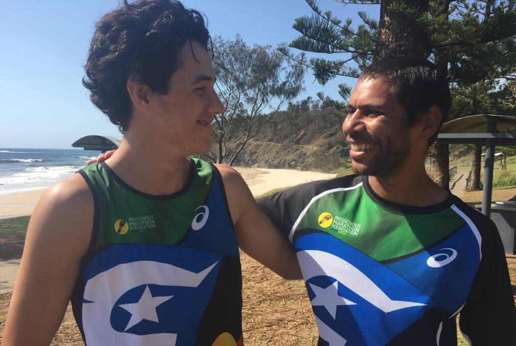 15 year-old Rylan Hunt and founder of the Bush to Beach Program Charlie Maher embrace. 