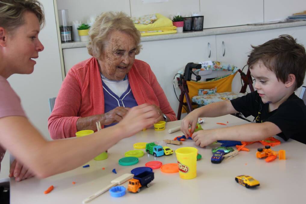Busy: Logan Taylor and his mum with June Foley having fun with play-doh. Photo: Megan Barber