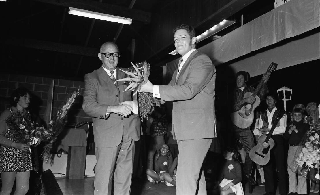 On song: Deputy Mayor, Ald. C. C. Adams presents one of the many gifts of appreciation at the closing night of Bye Bye Birdie, 1971.
