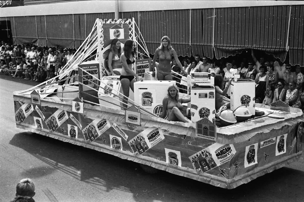 Bikinis in the kitchen: Oxley County Councils eye catching float in the Carnival of the Pines procession, 1971.